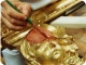 Il restauro di un'opera lignea dorata